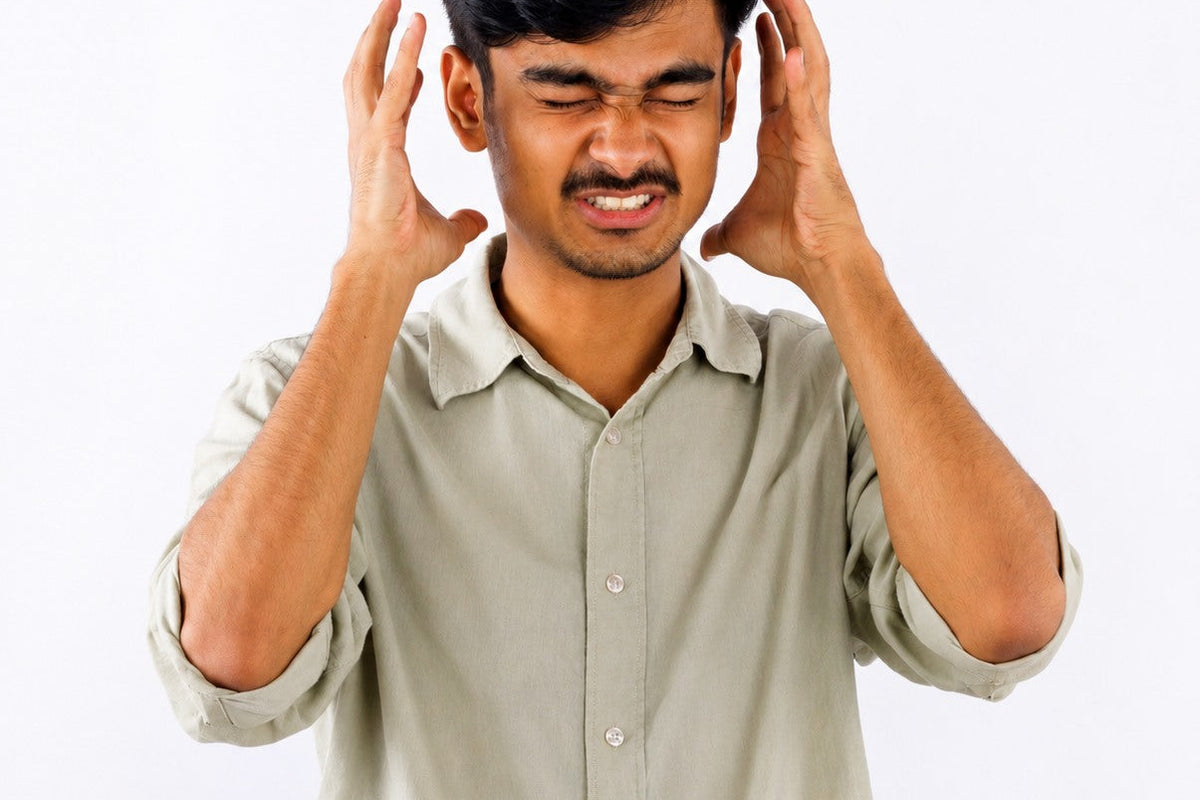 Young man experiencing anxiety related to digestive health